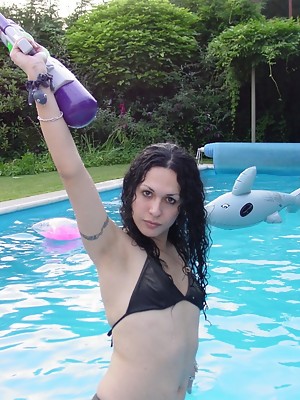 Amazing tgirl Nikki posing in the pool